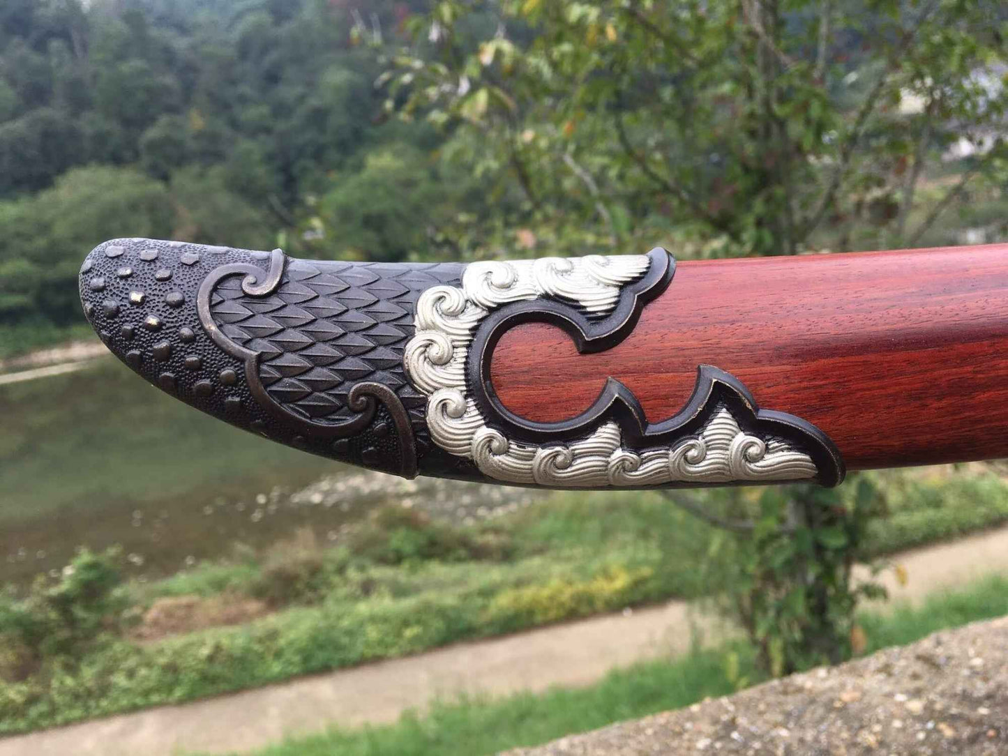 Crimson Dragon Qingdao | Hand-Forged Seven-Plate High-Carbon Steel Chinese Saber with Brass Fittings & Bloodwood Scabbard — handle and fittings close-up