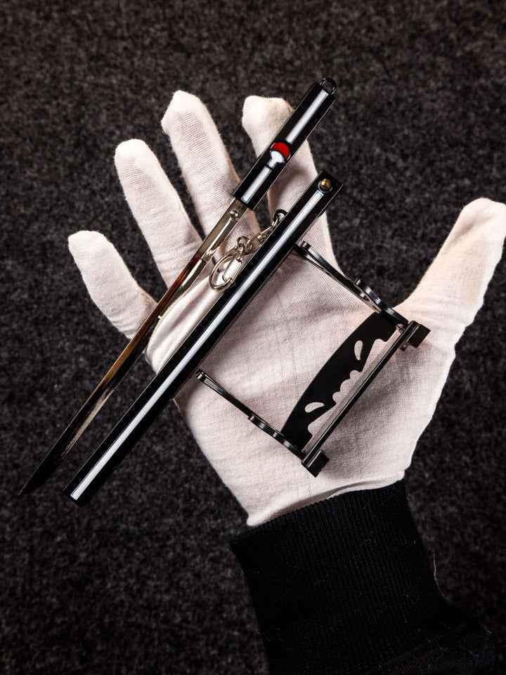 Sasuke Grass Cutter Keychain + Stand — handle and fittings close-up