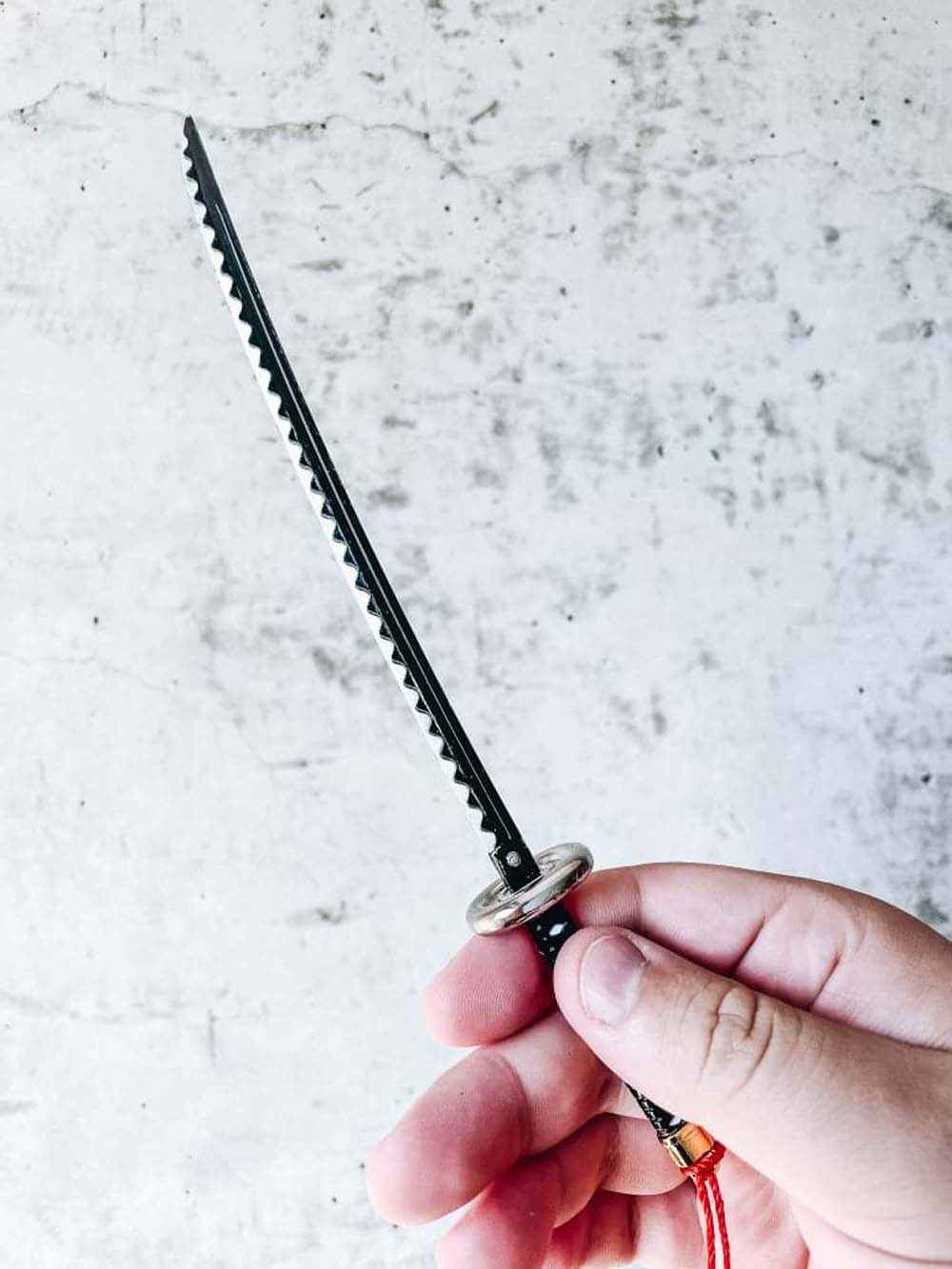 Law's Kikoku Keychain + Stand — close-up detail view