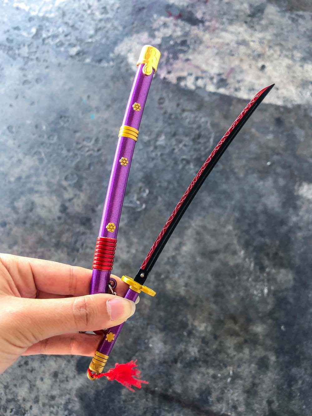 Enma Keychain (Purple) + Stand — close-up detail view