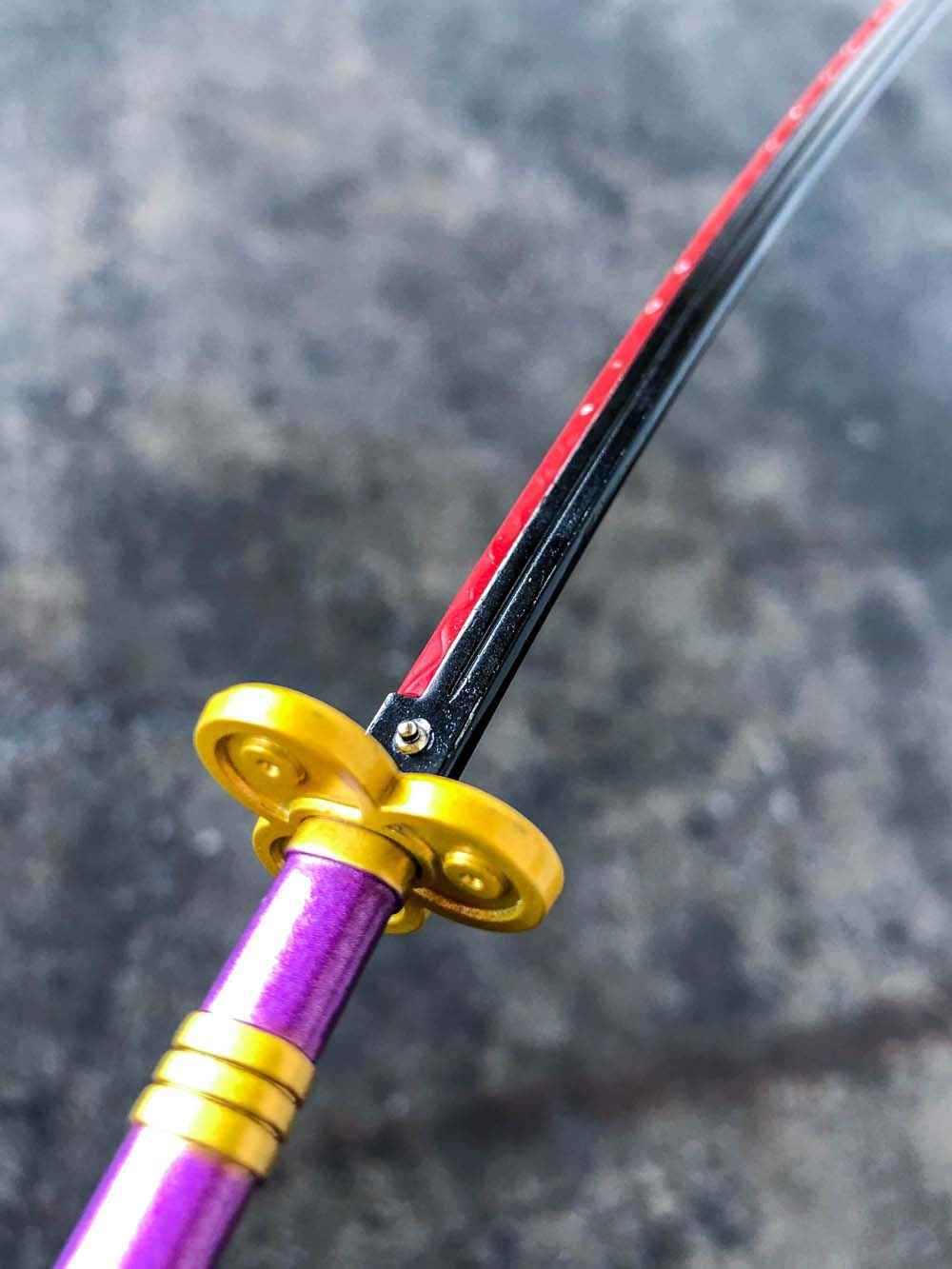 Enma Keychain (Purple) + Stand — handle and fittings close-up