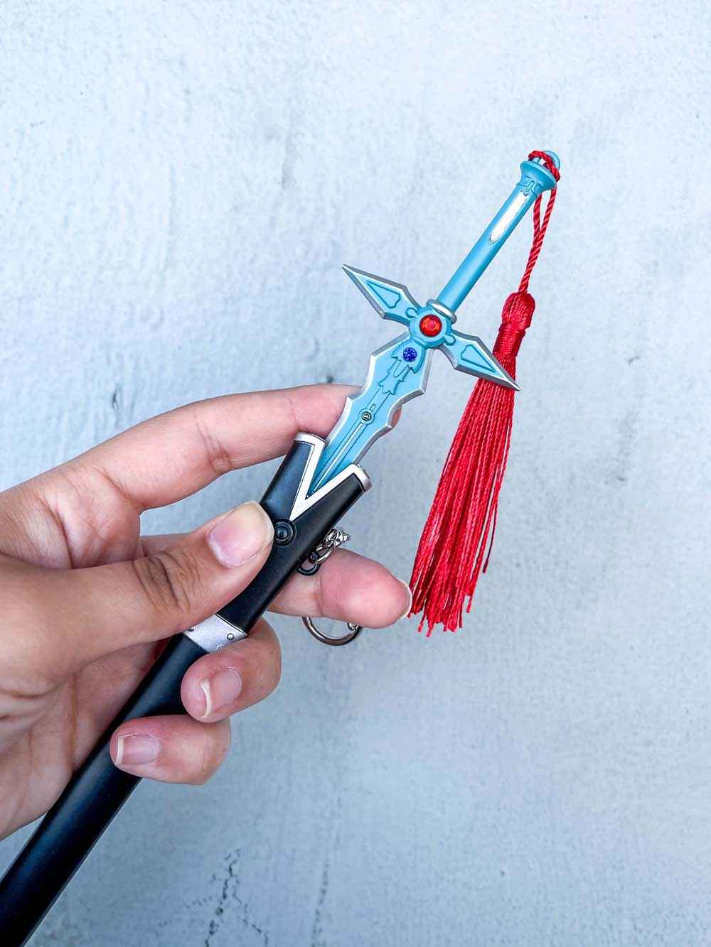Dark Repulser Keychain (Blue) + Stand — handle and fittings close-up