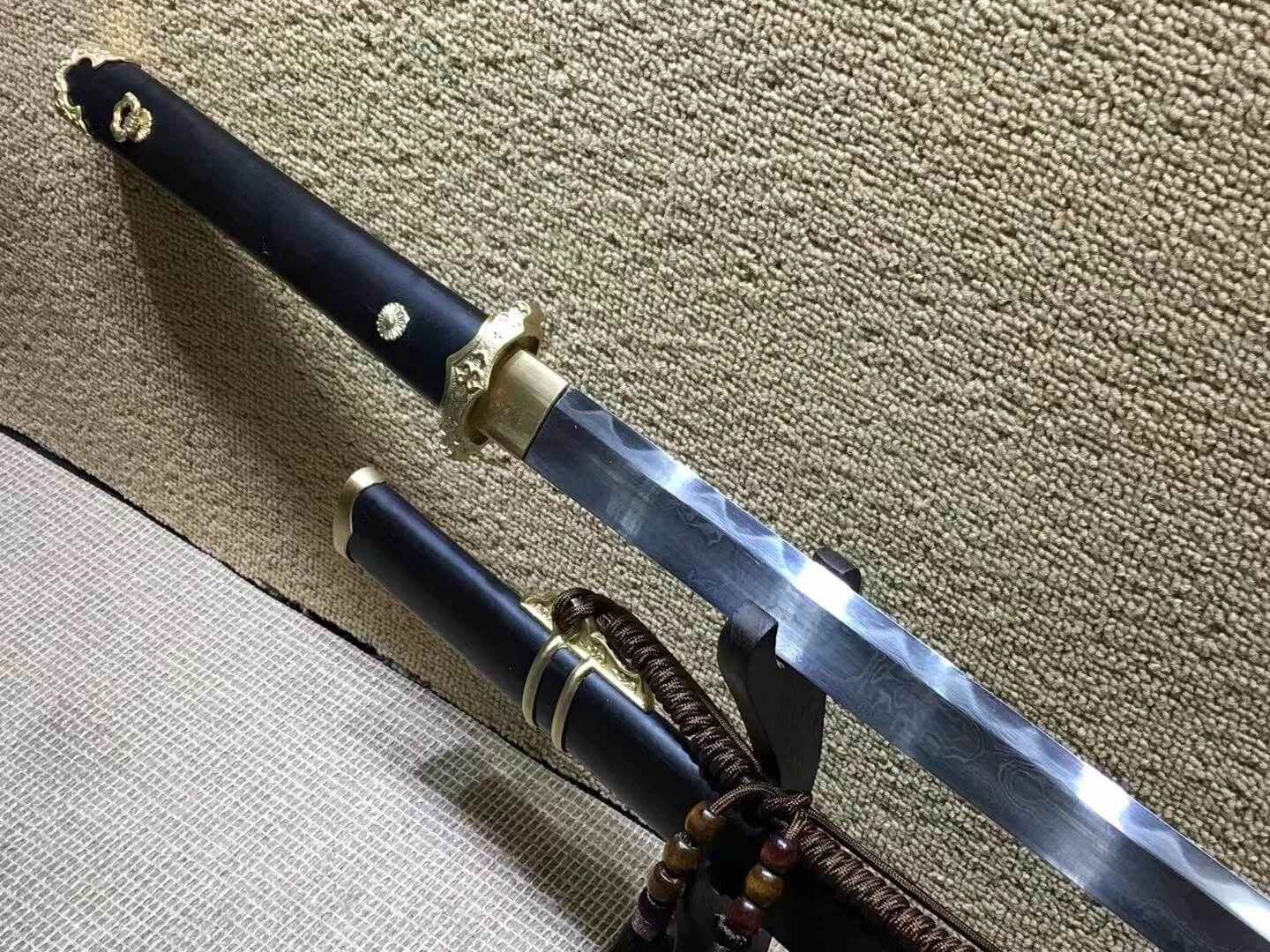 Tang dao,Damascus steel burn blade,Brass fittings,Black scabbard — close-up detail view