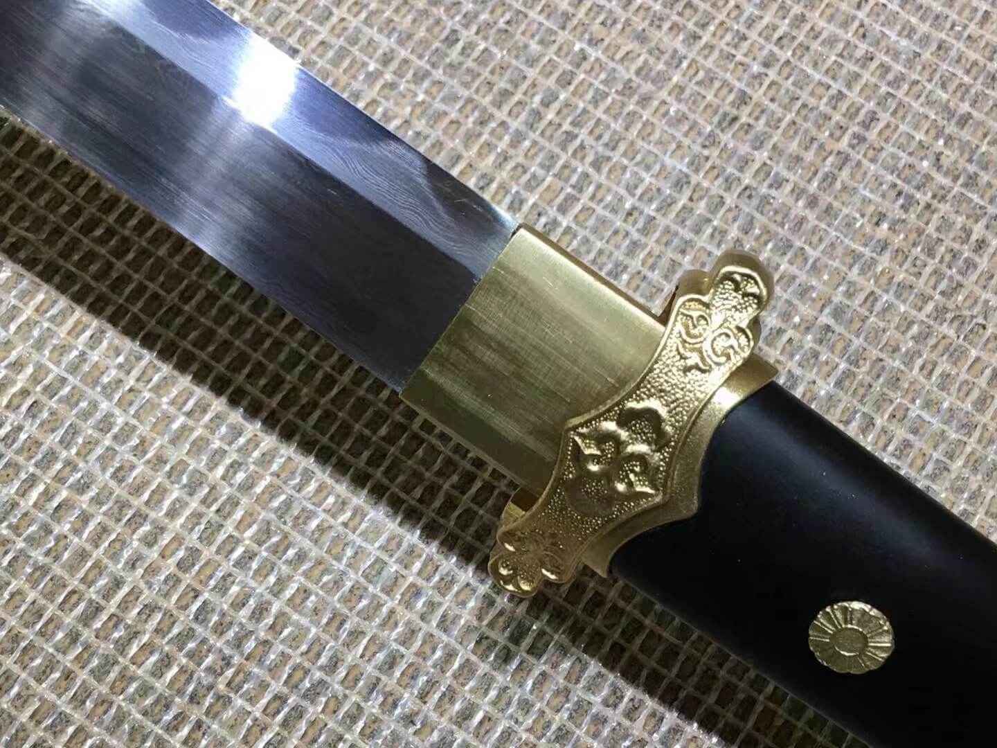 Tang dao,Damascus steel burn blade,Brass fittings,Black scabbard — handle and fittings close-up